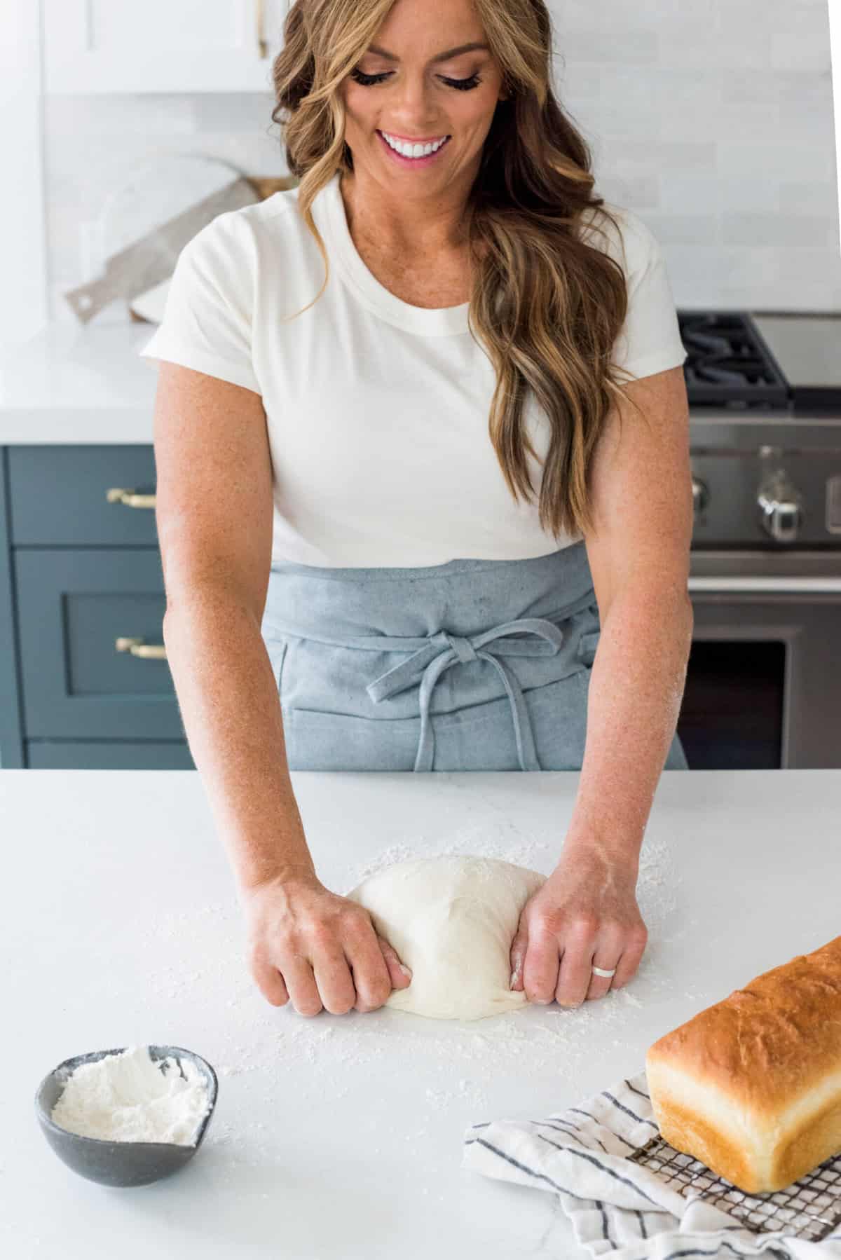 Close view of Alyssa kneading bread for this beginner
