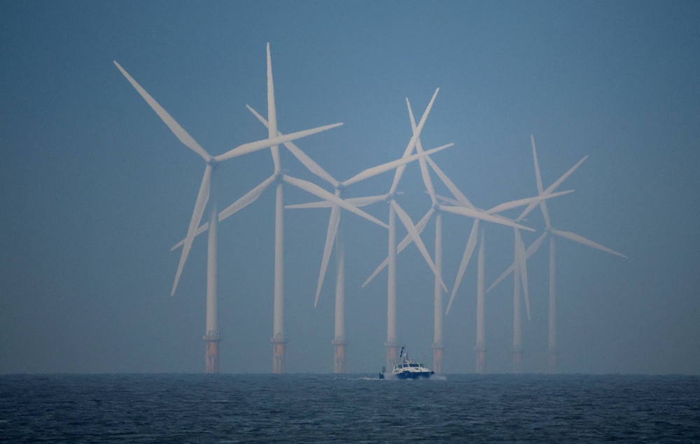 Wind turbines near New Brighton, England. According to the International Energy Agency, Japan could produce over 900% of its energy demand with offshore wind alone.