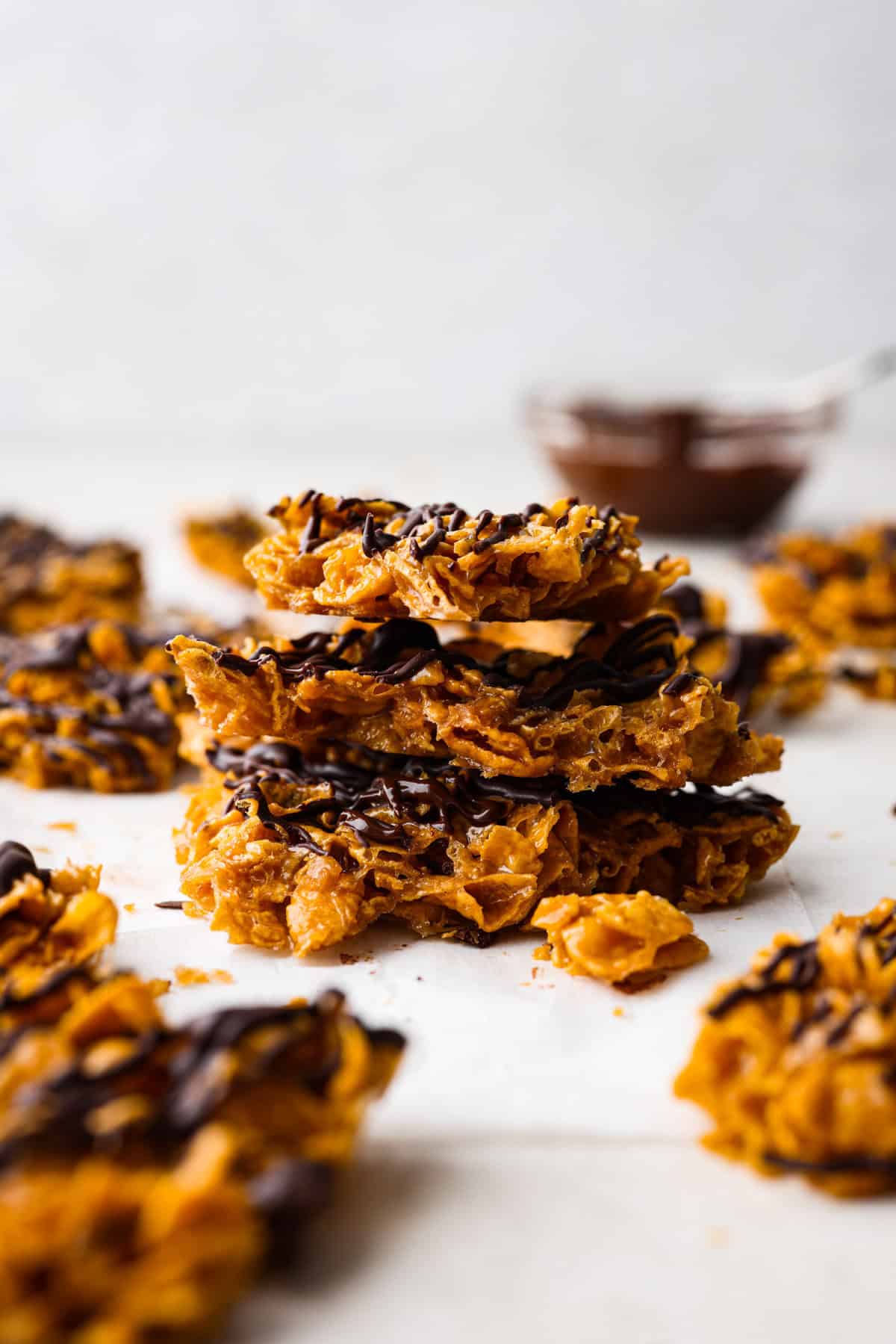 Side shot of stacked pieces of cornflake brittle crack.