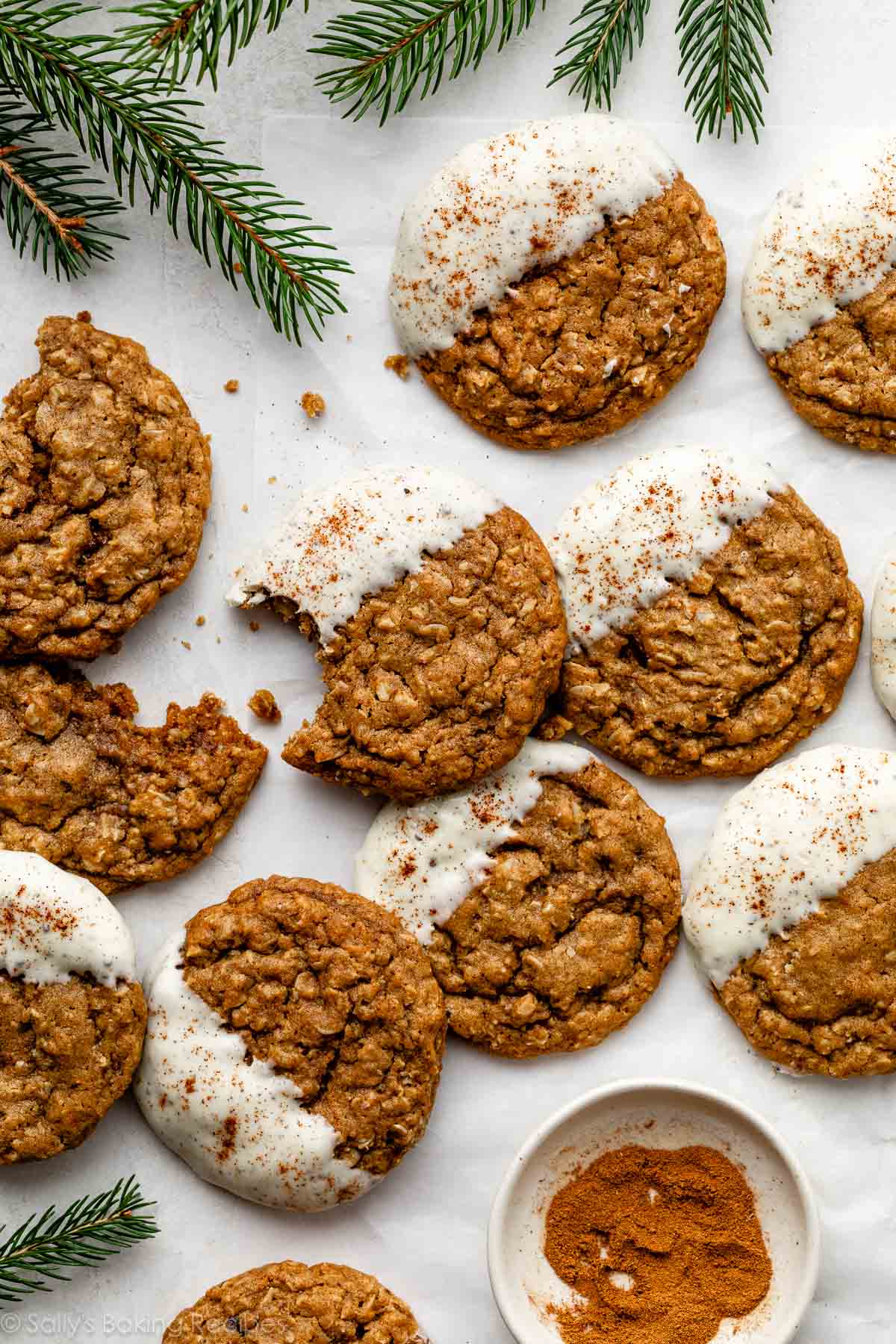 white chocolate dipped gingerbread latte cookies with cinnamon sprinkled on top.