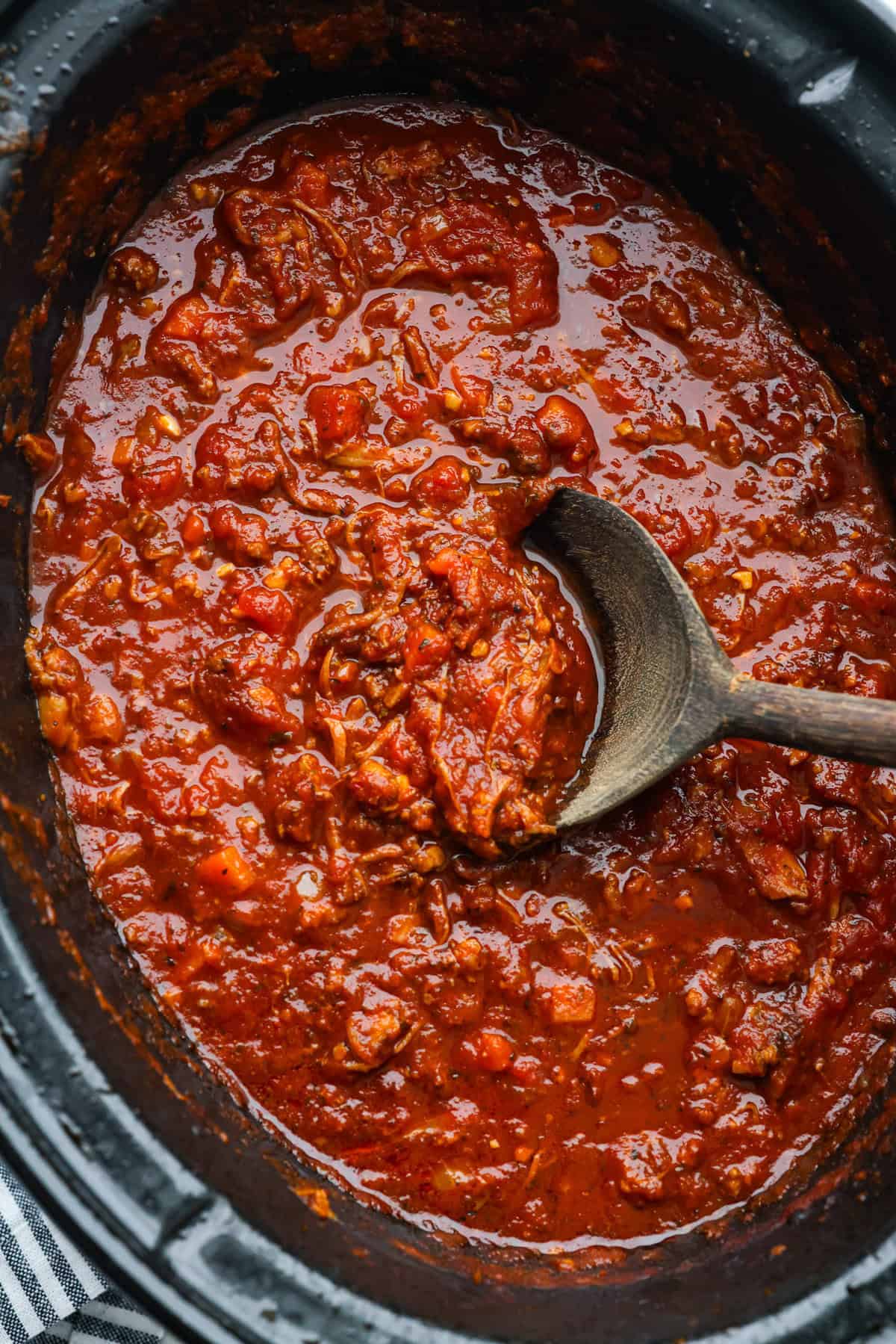 Overhead shot of slow cooker Sunday sauce in a crockpot.