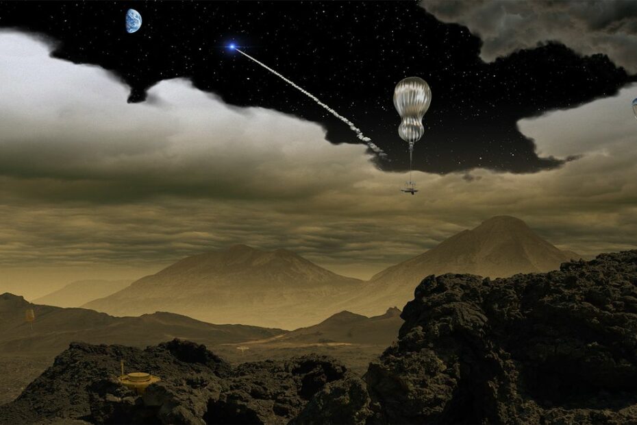 silver balloons float in a yellow-grey sky above black-and-yellow mountains