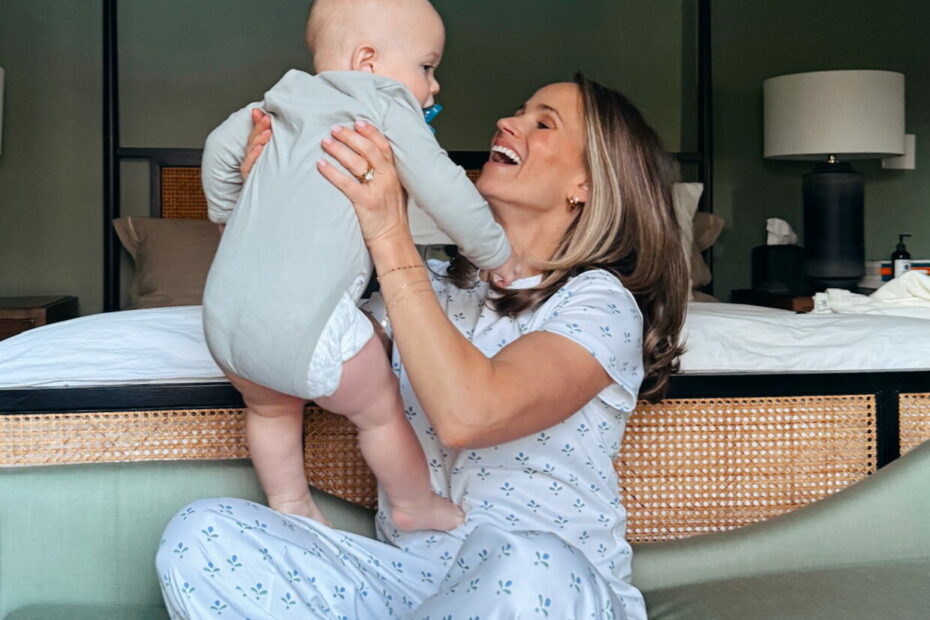 Woman wearing Lake pajamas while holding her baby
