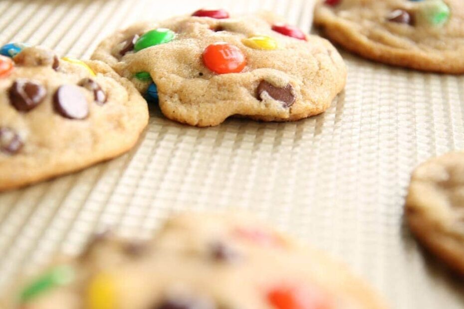 M and M cookies on a cooling rack.