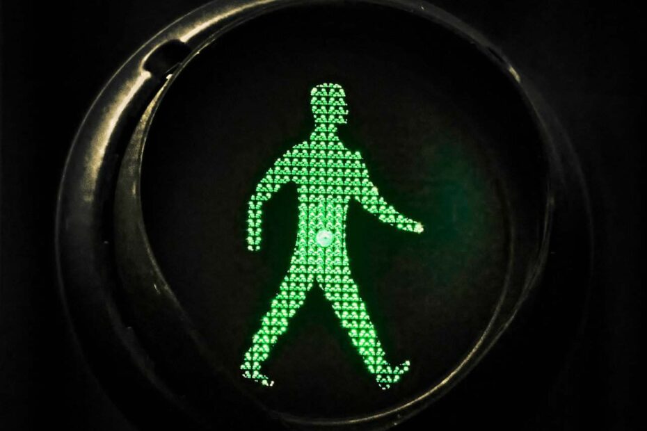 a green figure in a circle