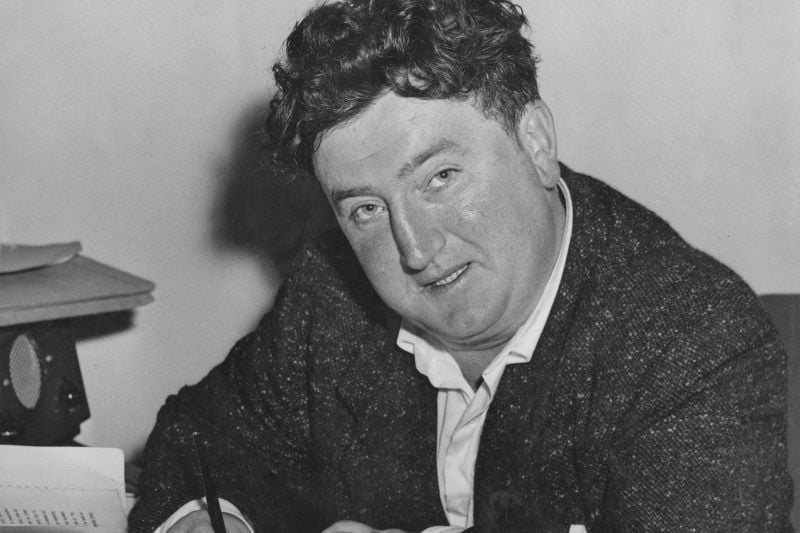 Brendan Behan signs a production contract for his play 'The Quare Fellow' at the Comedy Theatre in London, 10th July 1956