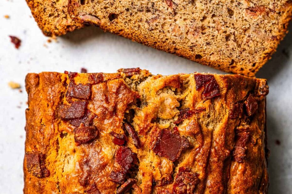 Overhead view of a peanut butter banana bread loaf with slices cut from the end.