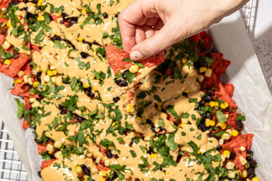 hand holding vegan nacho