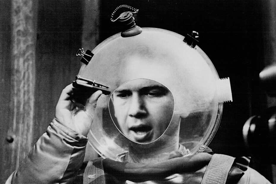 A black-and-white image of a television astronaut in a bubble helmet