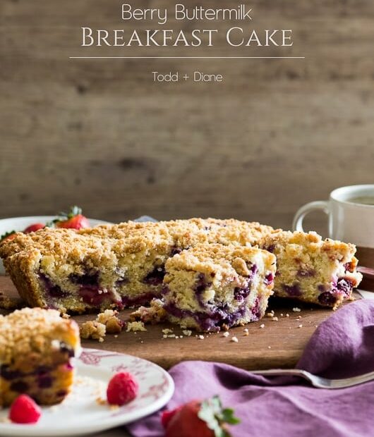 Blueberry Buttermilk Breakfast Cake with Berries on a cutting board