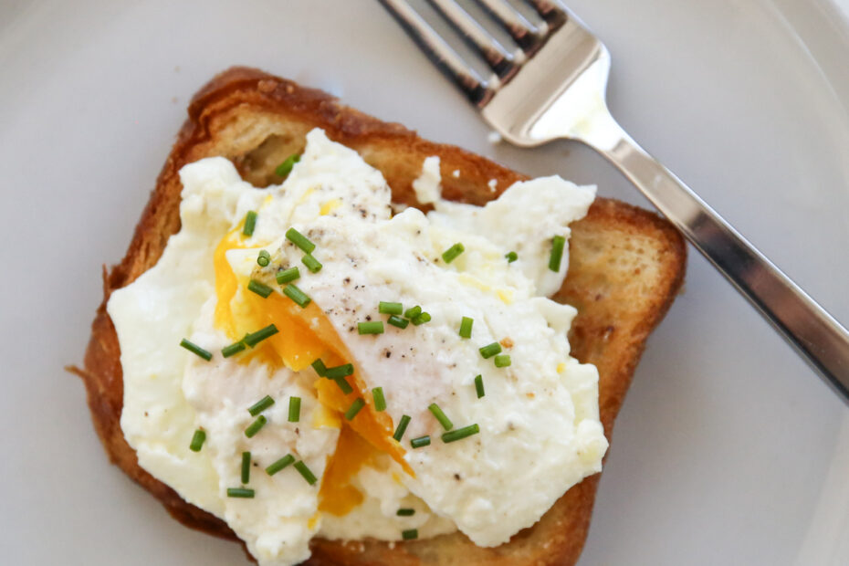 cream fried egg on toast with chives