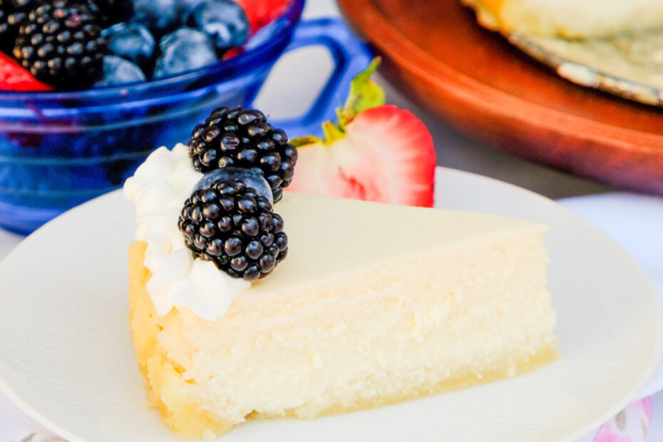 A slice of keto cheesecake made with cottage cheese on a white serving plate.