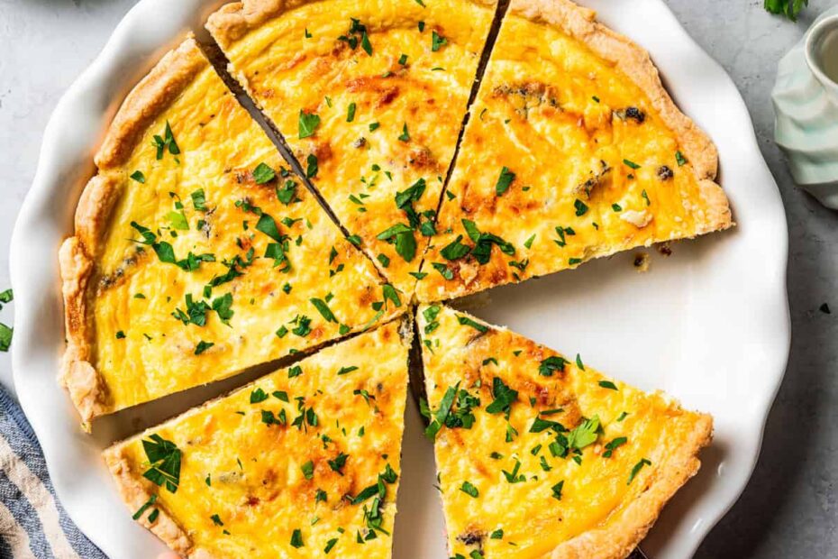 Quiche Lorraine in a pie plate, cut into slices.