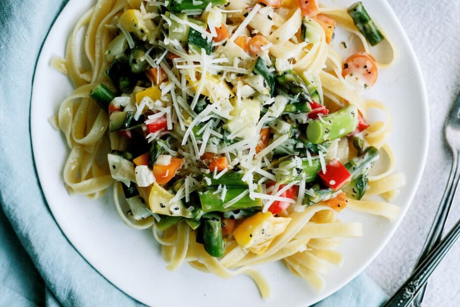 top down view of pasta primavera on a white plate