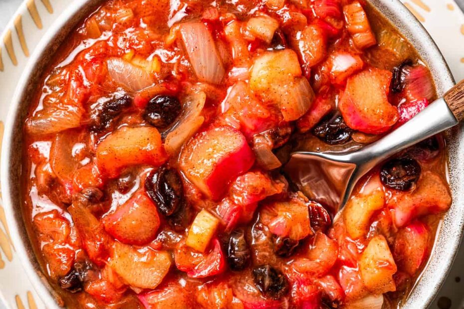 A spoon stirring through homemade chutney.