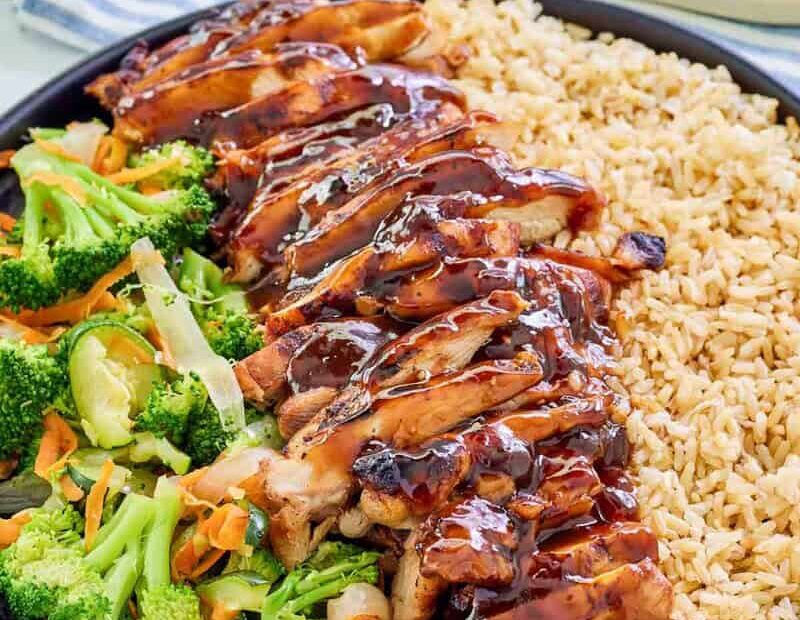 Copycat Teriyaki Madness chicken teriyaki with rice and mixed vegetables.