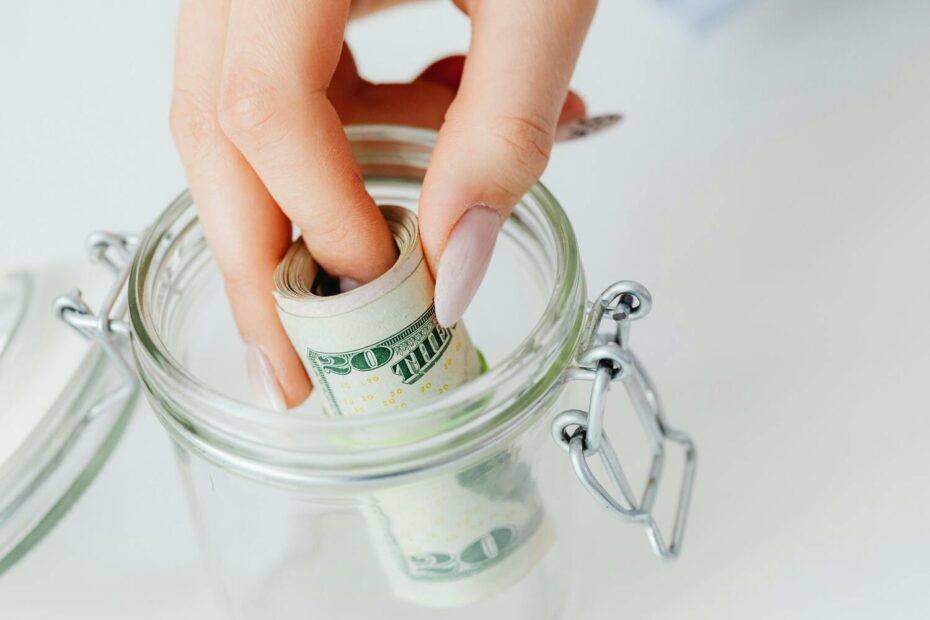 putting money in a jar, emergency fund