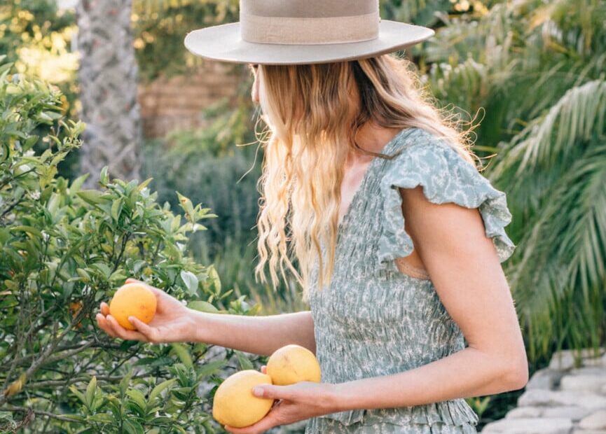 Woman picking lemons