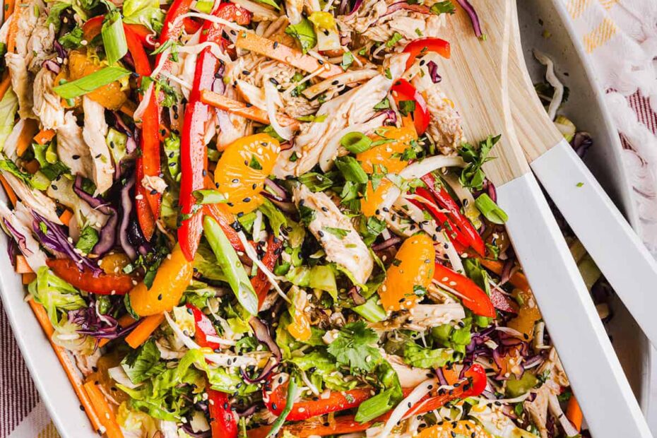This Chinese Chicken Salad is loaded with fresh lettuce, cabbage, carrots, sweet mandarin oranges, crunchy almonds and cilantro all tossed together with a delicious ginger-sesame vinaigrette!