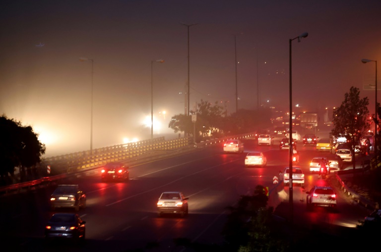 Traffic flows on a highway in the Iranian capital Tehran following Israeli strikes