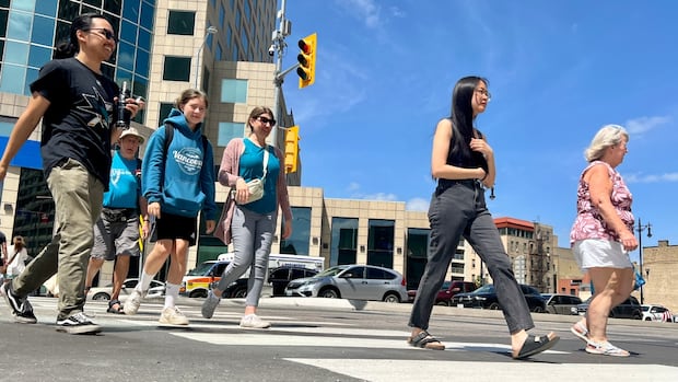 Winnipeg's Portage and Main reopens to pedestrians for 1st time in decades | CBC News