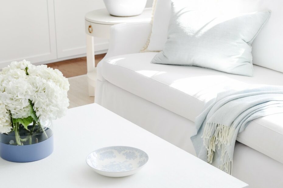A white coffee table in a living room inspired by the Serena and Lily look.