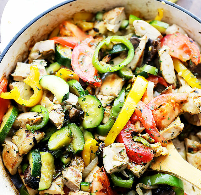Overhead view of chicken ratatouille in a large skillet.