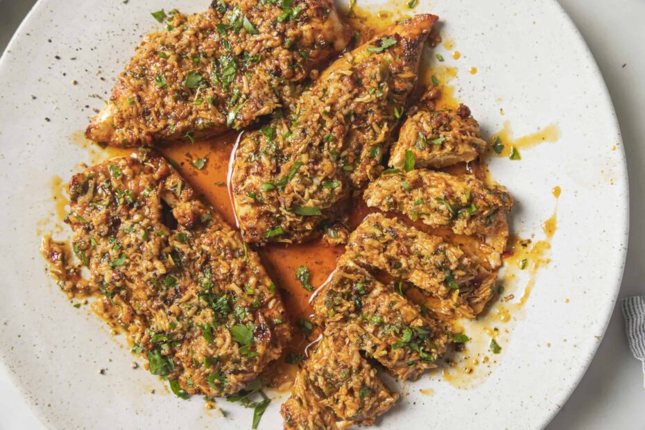 parmesan chicken sliced on a plate
