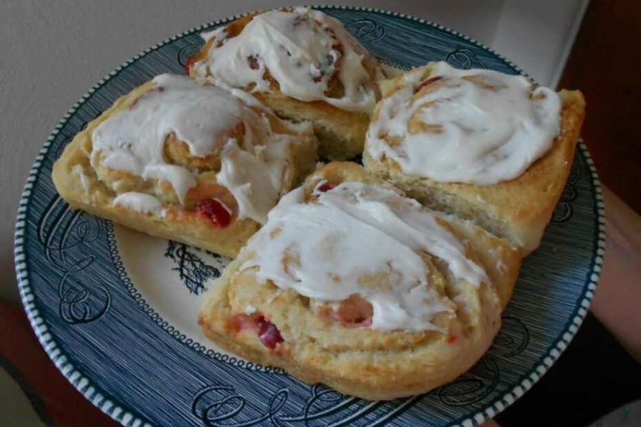 Sweet yeast rolls on a plate frosted