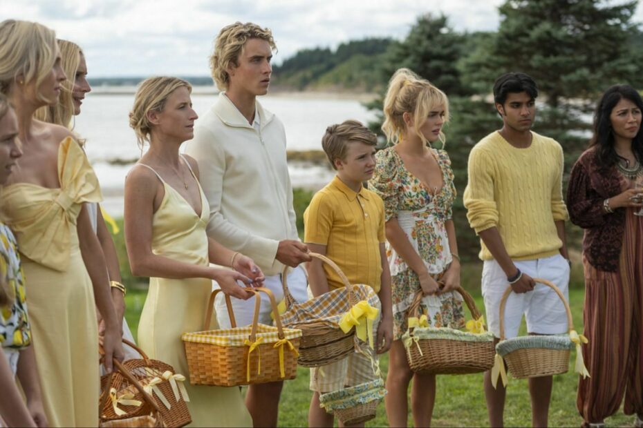 Sinclair family members dressed in yellow and white holding baskets for a picnic scene in We Were Liars.