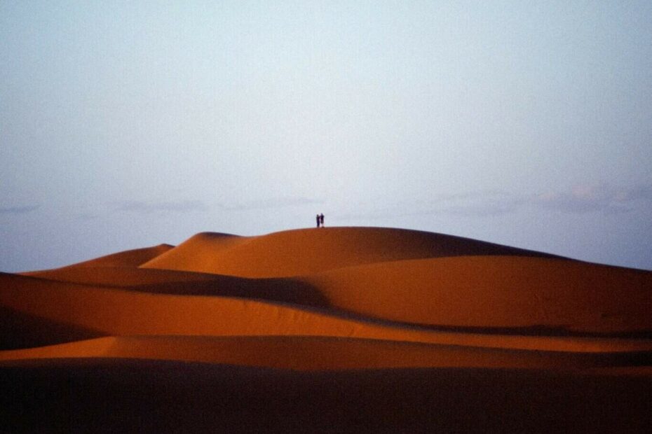 brown sand under white sky during daytime