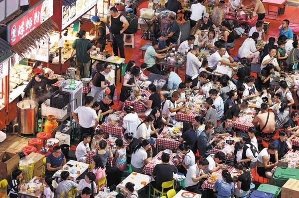 With 'smoke, fire and steam', night markets erupt into life