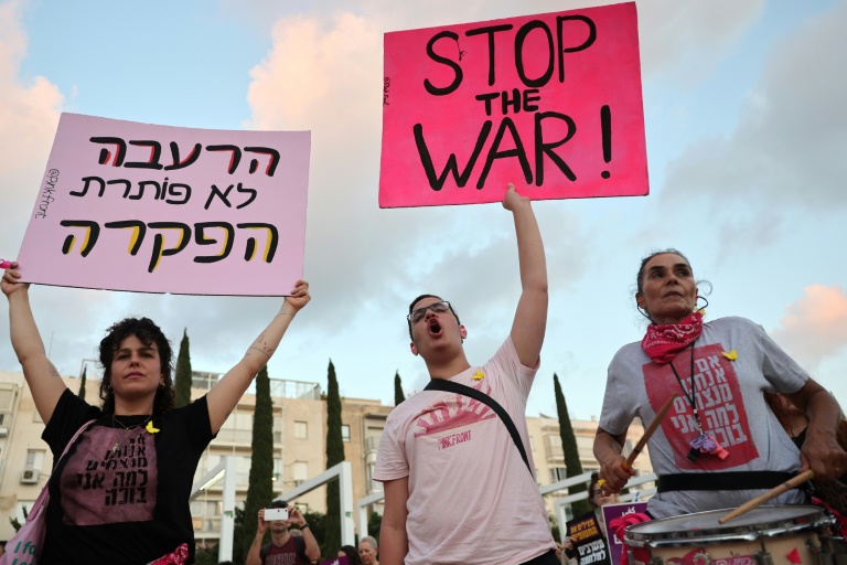 Demonstrators call for an end to the war in Gaza during an anti-government protest in Tel Aviv