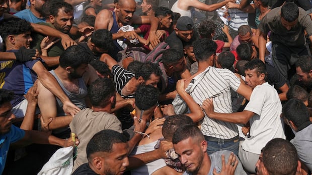 More than 100 aid groups call on Israel to end 'weaponization' of aid in Gaza | CBC News