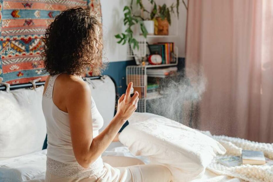woman-spraying air fresheners-in bedroom.jpeg