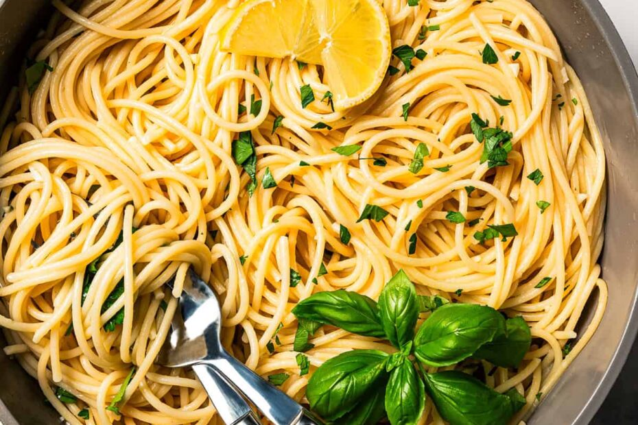 Garlic butter noodles twirled around a fork.