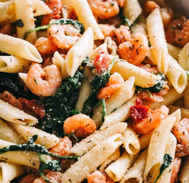 Garlic butter shrimp pasta in a large skillet.