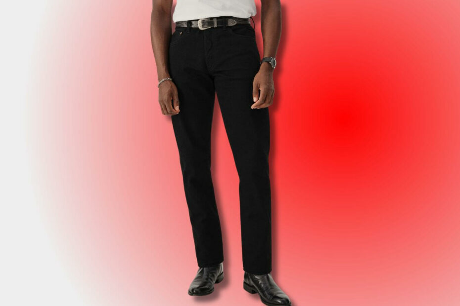 stylish man from the waist down wearing black jeans with a black western-style belt