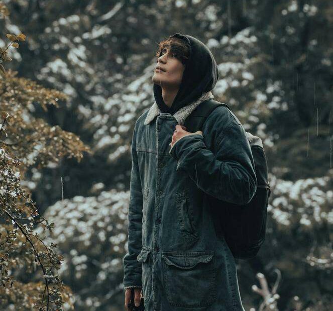 man-walking-in-nature-for how to stay positive in a negative world.jpg