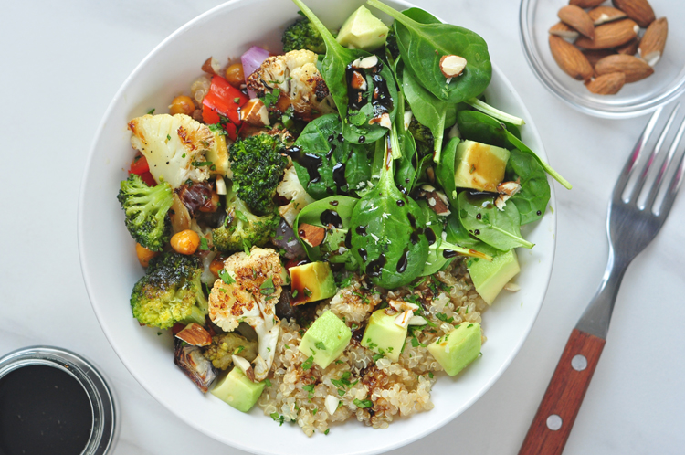 Colorful roasted veggie Buddha bowl with quinoa and greens