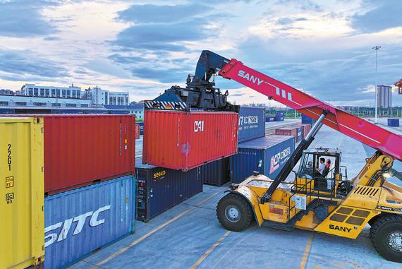 A forklift operator moves a container on the China-Europe Railway Express service in Ganzhou, Jiangxi province, in August. ZHU HAIPENG/FOR CHINA DAILY