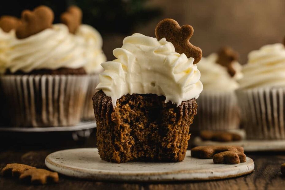 gingerbread cupcake with cream cheese frosting and gingerbread man decoration.
