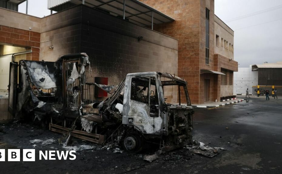 Israeli settlers set fire to Palestinian warehouse and land as West Bank attacks surge