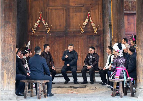 Chinese President Xi Jinping, also general secretary of the Communist Party of China Central Committee and chairman of the Central Military Commission, sits with villagers around a firepit to discuss all-around rural revitalization at a drum tower while visiting the Zhaoxing Dong village in Liping county of Qiandongnan Miao and Dong autonomous prefecture, Southwest China's Guizhou province, March 17, 2025. （Photo/Xinhua）