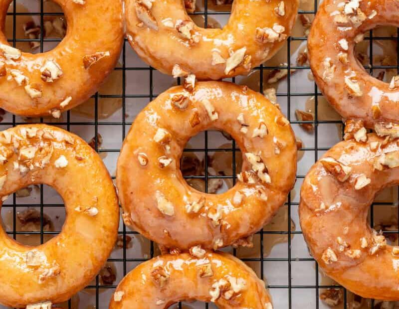 maple glazed donuts on a cooling rack