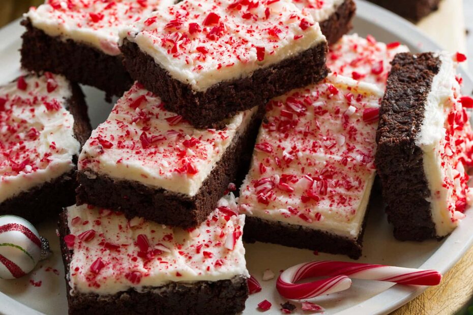 Plate of stacked frosted peppermint brownies.