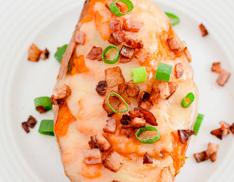 Twice baked sweet potatoes on a white plate.