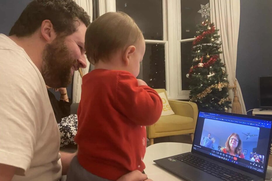 Colin and Baby C doing a video call on a laptop with grandma