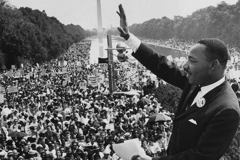 August 28, 1963: American minister and civil rights leader Dr Martin Luther King Jr waves to the crowd of more than 200,000 people gathered on the Mall after delivering his 'I Have a Dream' speech at the March on Washington for Jobs and Freedom, Washington DC.