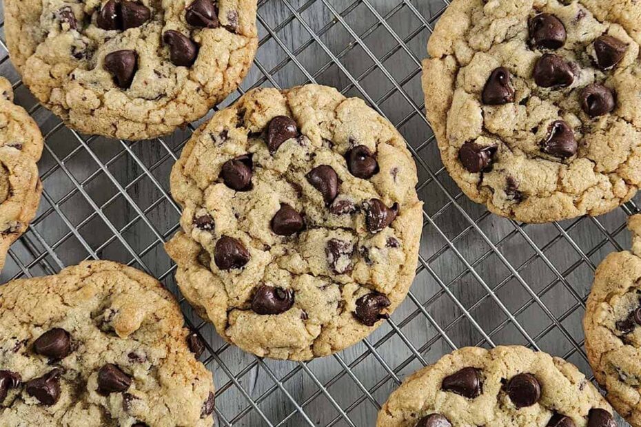 Chocolate chip cookies on a wire rack.